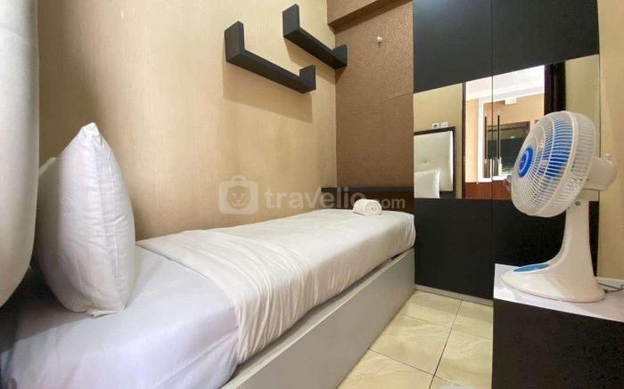 Comfy & Well Appointed 2BR at Tamansari Panoramic Apartment By Travelio