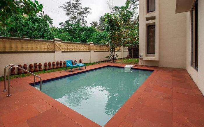 StayVista's Greenwoods Villa 1 - City-Center Villa with Private Pool, Terrace, Lift & Carrom Board