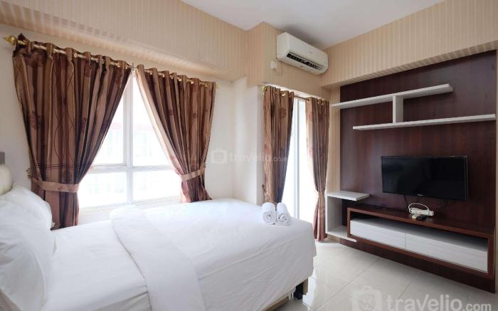 Warm Studio at Taman Melati Margonda By Travelio