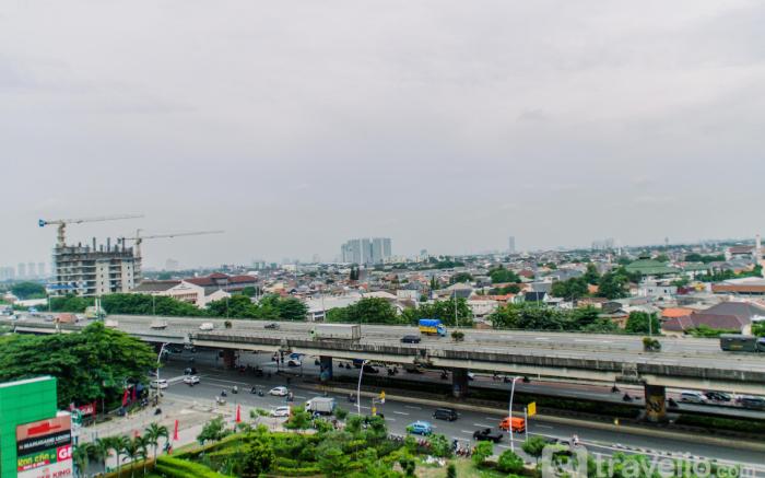 Warm & Cozy 2BR at Green Pramuka City By Travelio