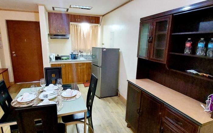 One (1) bedroom condo unit with common pool