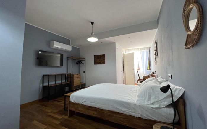 Camera familiare con bagno e terrazzino