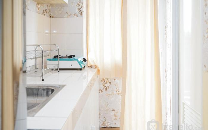 Homey Studio at Green Palm Residence By Travelio