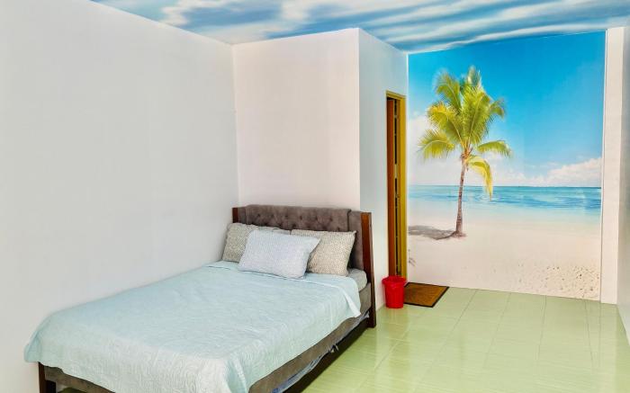 Refreshing 4 bedroom home with a waterfall pools