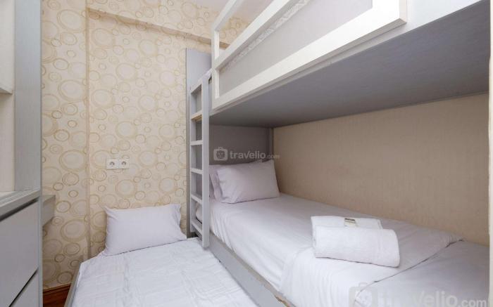 Minimalist & Warm 2BR at Bassura City By Travelio