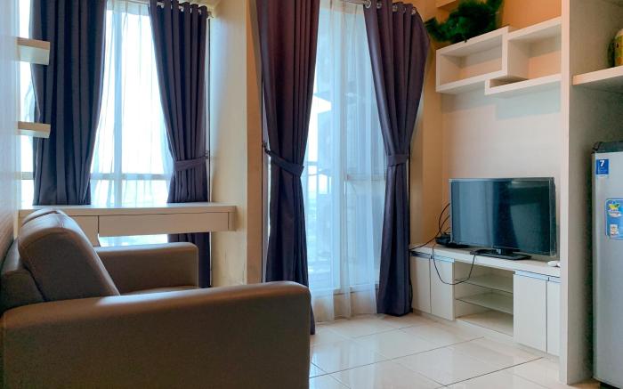 Warm and Cozy 2BR at Tifolia Apartment By Travelio