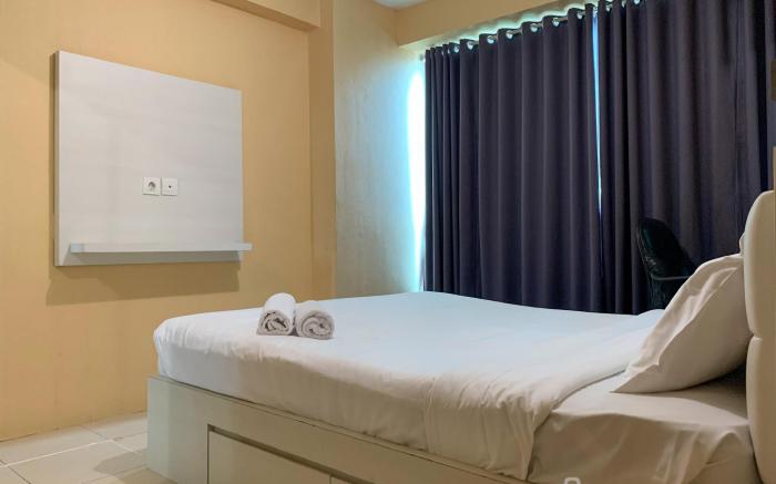 Warm and Cozy 2BR at Tifolia Apartment By Travelio