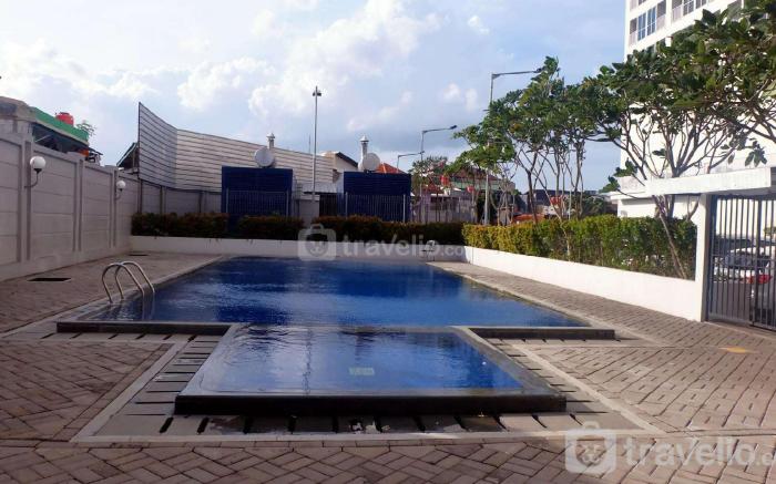 Homey and Warm Studio Room at Tifolia By Travelio