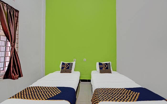 SPOT ON 92255 Lucky Guesthouse