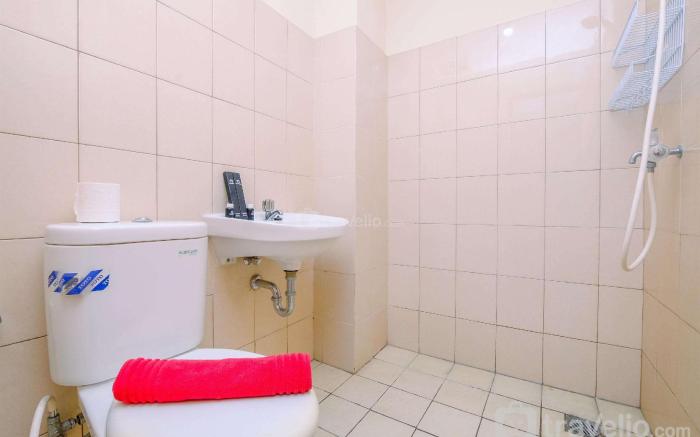 Comfortable and Warm 2BR at Tifolia By Travelio