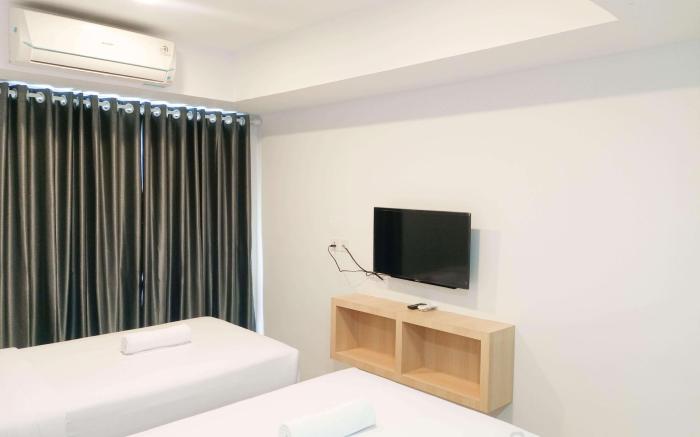Homey Studio at De Prima Apartment By Travelio