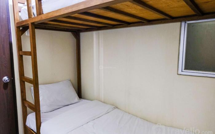 Homey 2BR at Suites Metro Apartment By Travelio