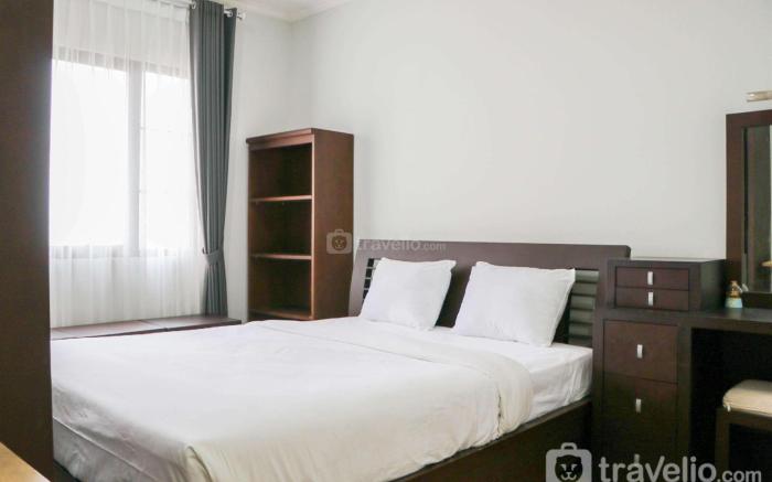 Cozy Living and Modern 2BR Puri Garden By Travelio