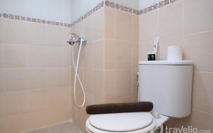 WarmDesigned 2BR at Podomoro Golf View By Travelio