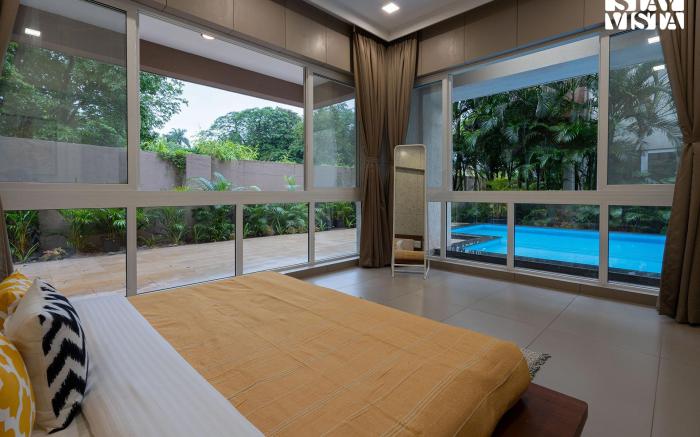 StayVista's Rosso with Outdoor Pool, Theatre-Disc Room & Games Room