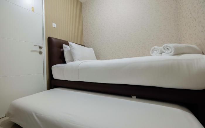 Homely 2 BR Bassura City Apartment By Travelio