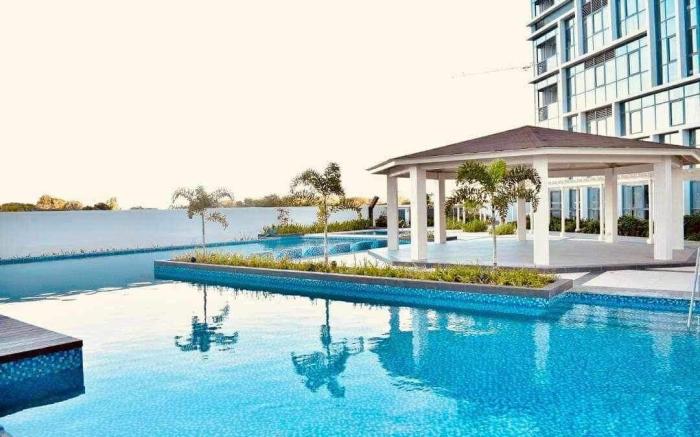 Mactan Newtown 2 BR w/ 4 beds +Pool access