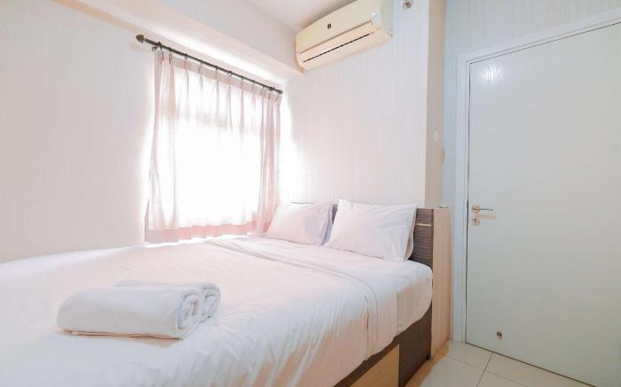 Homey 2BR at Green Pramuka City Apt By Travelio