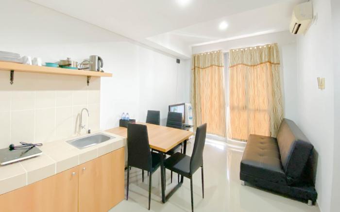 Homey 2BR Apt at Royal Olive Residence By Travelio