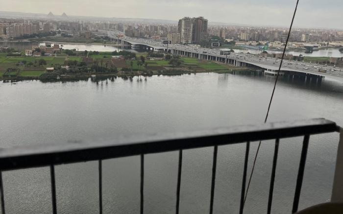 Maadi Nile and pyramids view