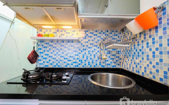 Apt 2BR Pool View Green Pramuka City By Travelio