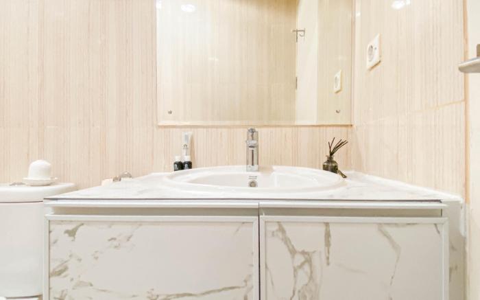 Warm Cozy 1BR at Sentul Tower Apt By Travelio