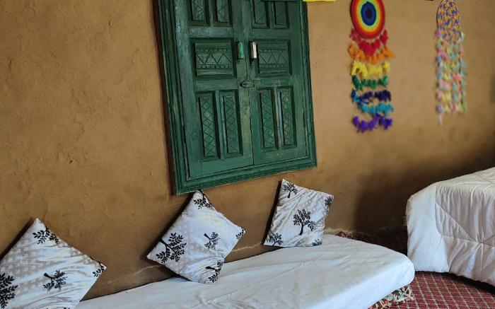 Earthen Pods: Rustic Mud House & Cozy Huts