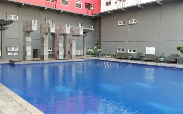 Combined 1BR Apt at Green Pramuka City By Travelio