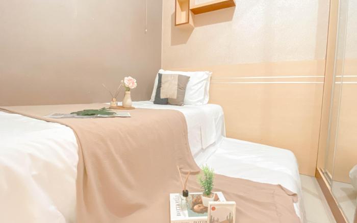 Simple Style 2BR at Green Pramuka City By Travelio