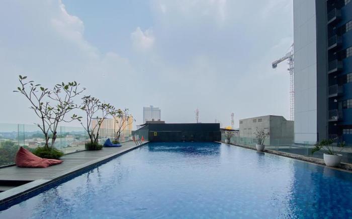 Wooden Nest 2BR Evenciio Margonda Apt By Travelio