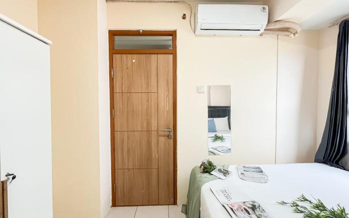 Basic 2BR Apt at Green Palm Residence By Travelio