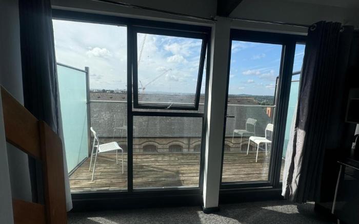 Kick back relax stylish space with balcony