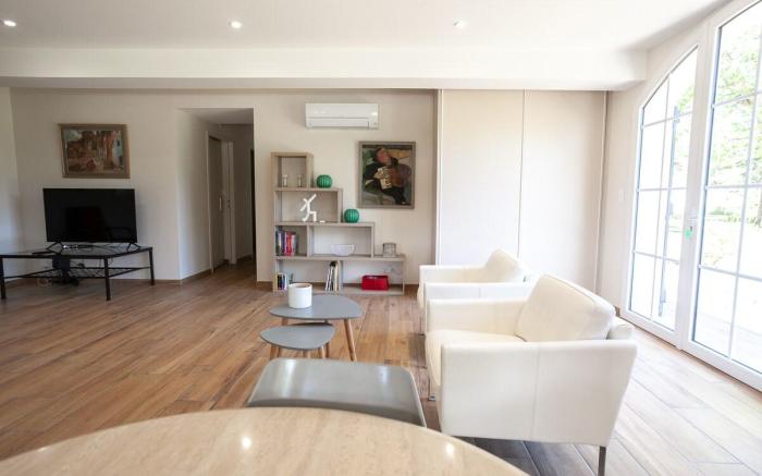 Large house in the forest bordering a lake