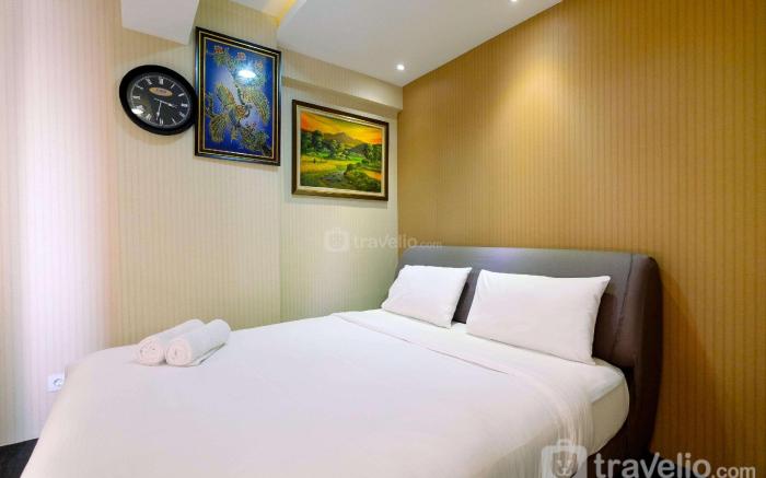 Homey 2BR at Green Bay Pluit Apartment By Travelio