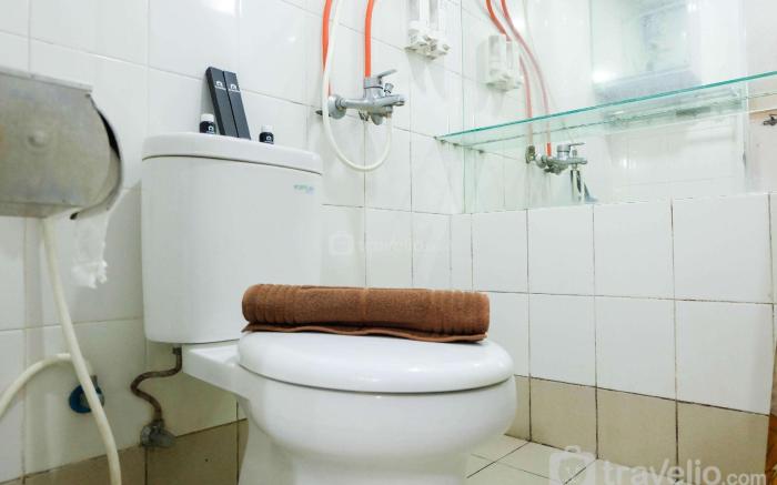 Modern 2BR with City View at Bassura Apartment By Travelio