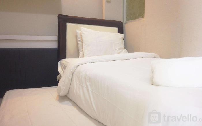 Trendy 2BR @ The Suite Metro Apartment By Travelio