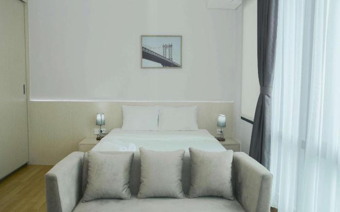 Studio Room @ Capitol Suites Apartment By Travelio
