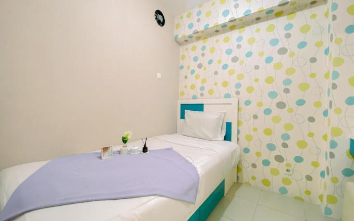 Relaxing 2BR Bassura City Apartment By Travelio