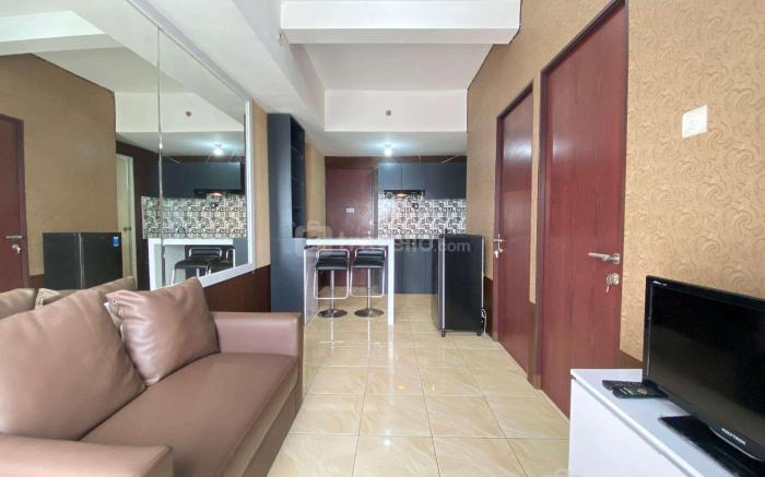 Comfy & Well Appointed 2BR at Tamansari Panoramic Apartment By Travelio