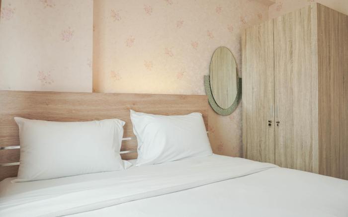 Comfort 2BR Green Pramuka City Apartment near Shopping Center By Travelio