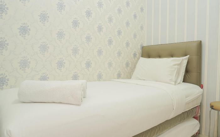 Comfort 2BR Green Pramuka City Apartment near Shopping Center By Travelio