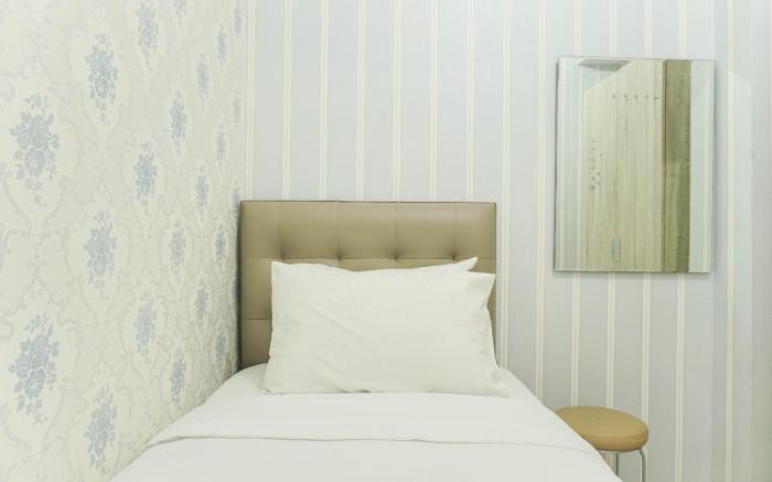 Comfort 2BR Green Pramuka City Apartment near Shopping Center By Travelio
