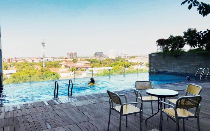 Warm Studio Apt at Tamansari Papilio By Travelio