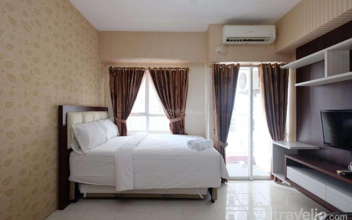 Warm Studio at Taman Melati Margonda By Travelio