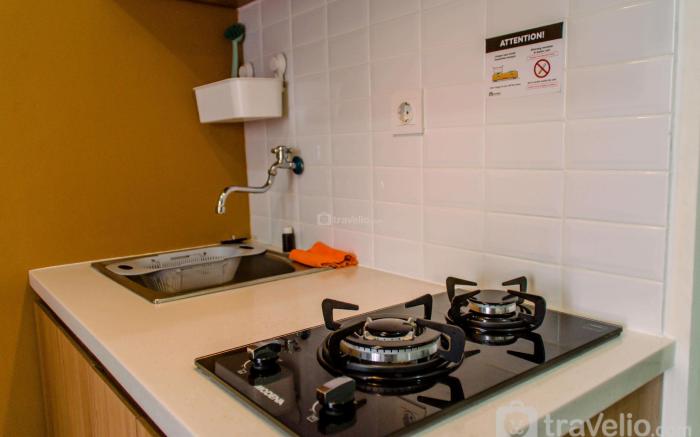 Warm & Cozy 2BR at Green Pramuka City By Travelio