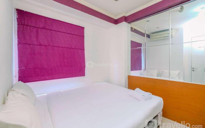Comfy 2BR Green Pramuka City Apartment By Travelio