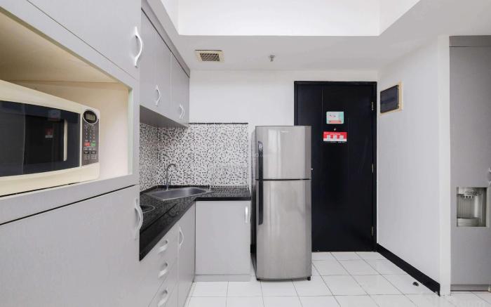 Nice and Elegant 1BR The Wave Kuningan By Travelio