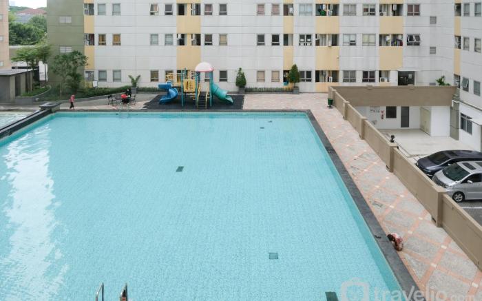 Homey 2BR at Puncak Permai Apartment By Travelio