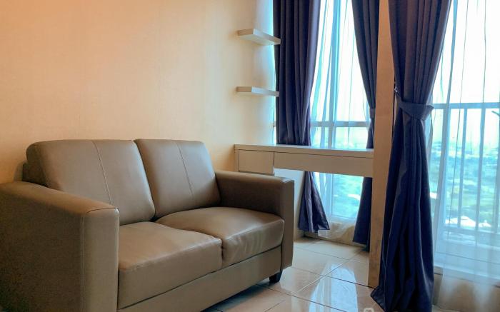 Warm and Cozy 2BR at Tifolia Apartment By Travelio