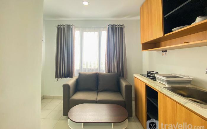 Comfort 1BR Patraland Urbano Apartment By Travelio